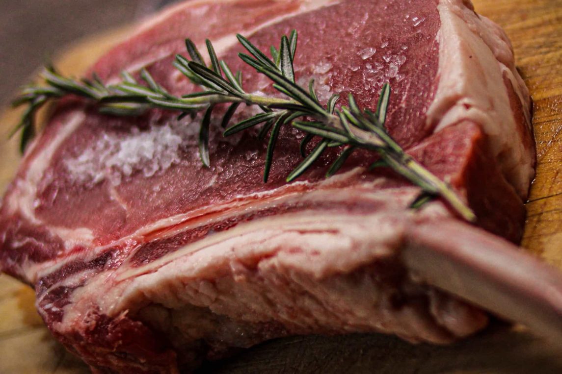steak on the bone with salt and rosemary