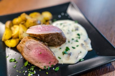 Sliced steak with potatoes